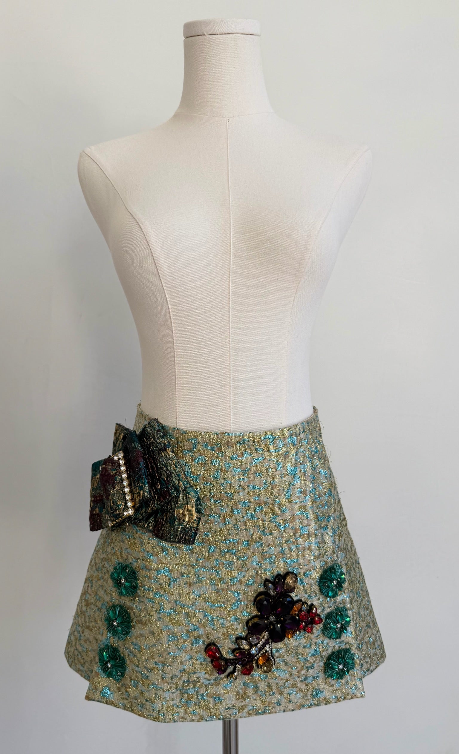 Green & Blue Metallic Jacquard Embellished Mini Skirt with Jewel Buckled Bow