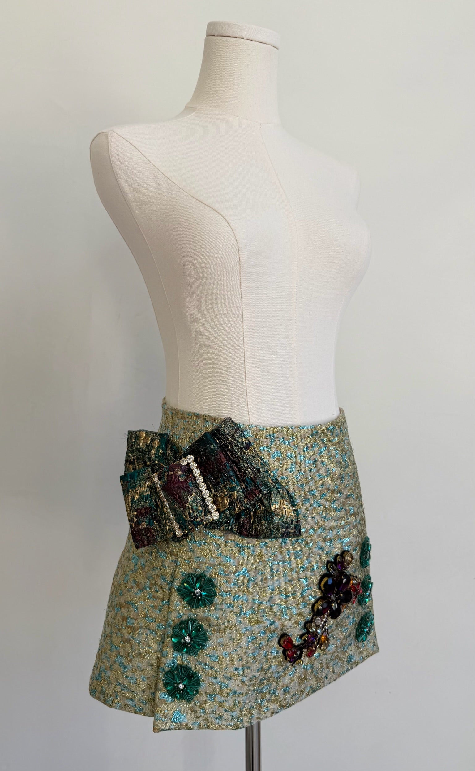 Green & Blue Metallic Jacquard Embellished Mini Skirt with Jewel Buckled Bow