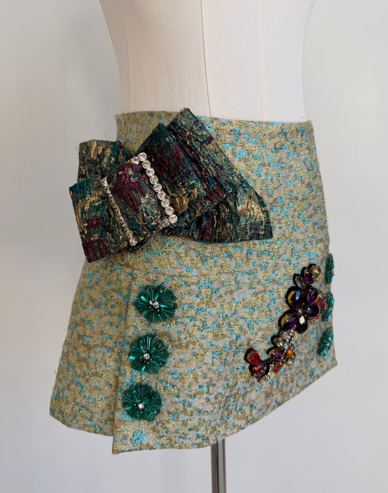 Green & Blue Metallic Jacquard Embellished Mini Skirt with Jewel Buckled Bow